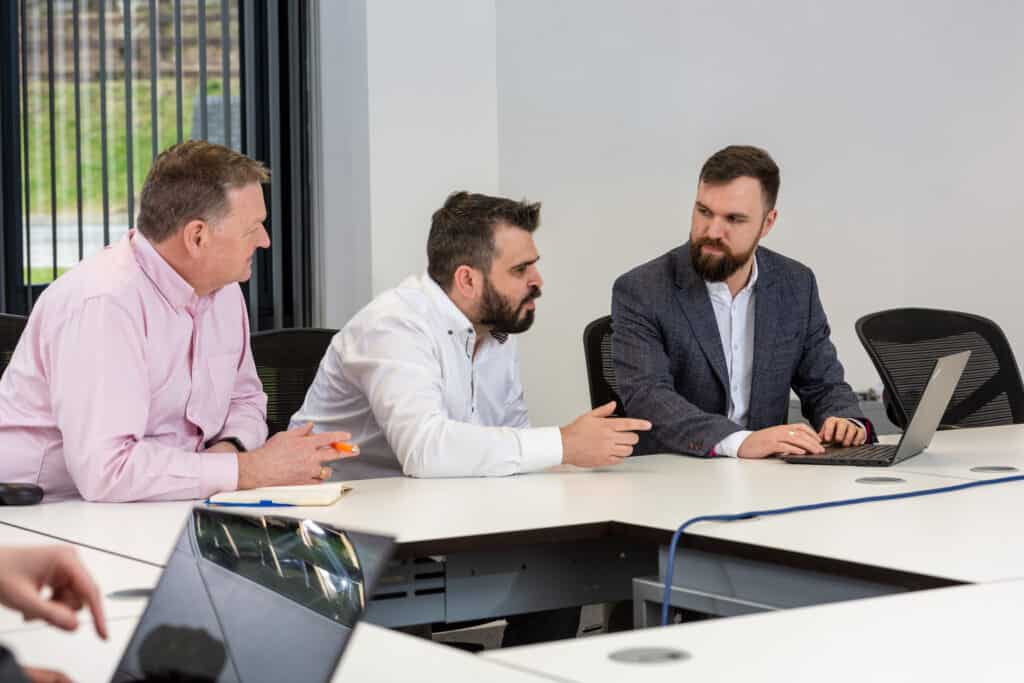 Don, Panos, and Richard in a meeting